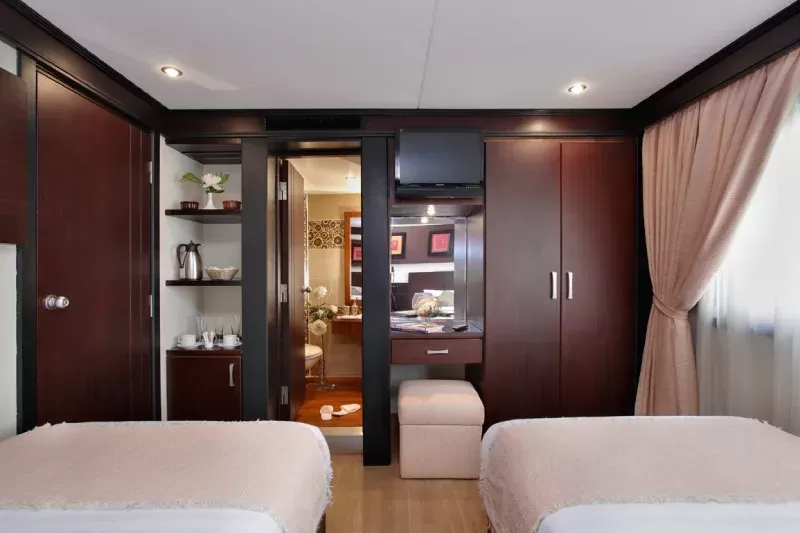 Luxury deluxe cabin with panoramic window aboard Merit Dahabiya Nile Cruise