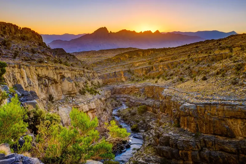 Dramatic cliffs and deep canyon views at Wadi Ghul, known as Oman’s Grand Canyon.