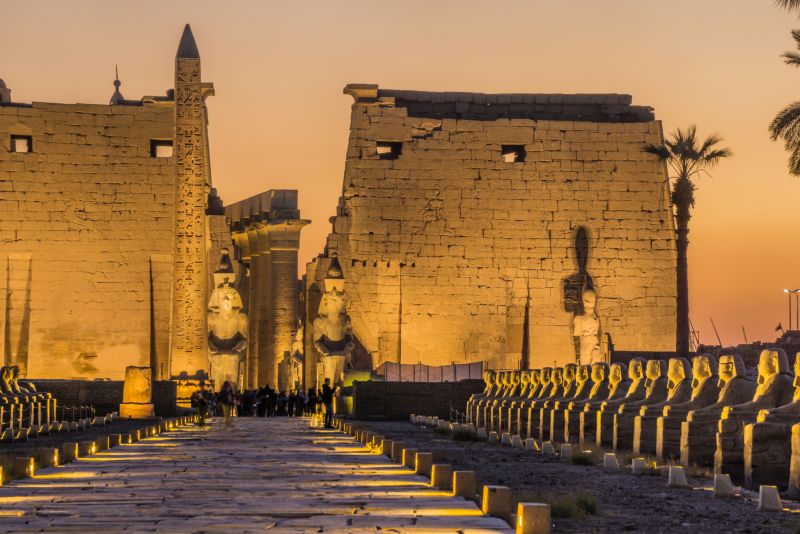 Illuminated Luxor Temple at sunset