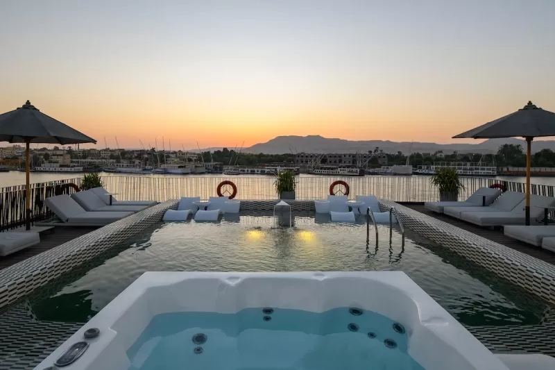 Soleil Nile Cruise sun deck with seating and view of tranquil Nile waters