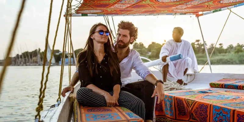 Private felucca ride in Aswan Egypt with panoramic views of the Nile River and lush riverbanks