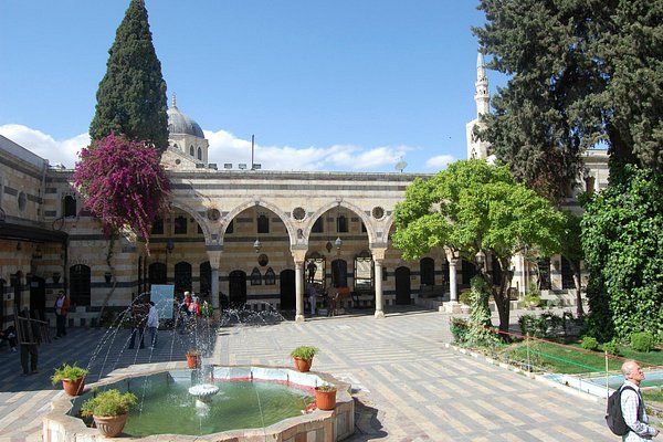 Streets of Old Damascus with traditional souks, historic buildings, and vibrant local life.