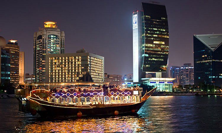Dhow dinner cruise on Dubai Marina skyline at night