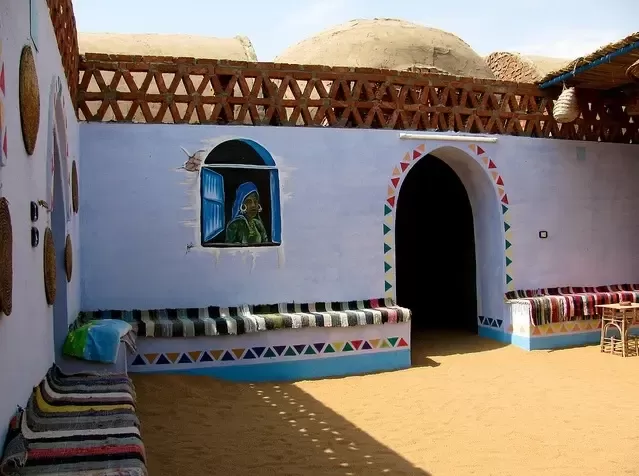 Nubian Village Tour in Aswan, Egypt, featuring colorful houses, local culture, and Nile River views