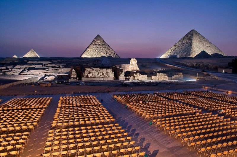 Enjoy the magical Sound and Light Show at the Giza Pyramids during an 8 Days Luxury Egypt Tour experience.