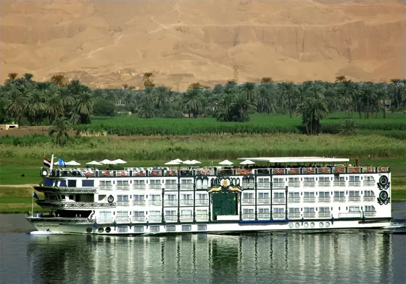 Sonesta St. George Nile Cruise by the riverbank – classic French‑style vessel sailing with refined charm