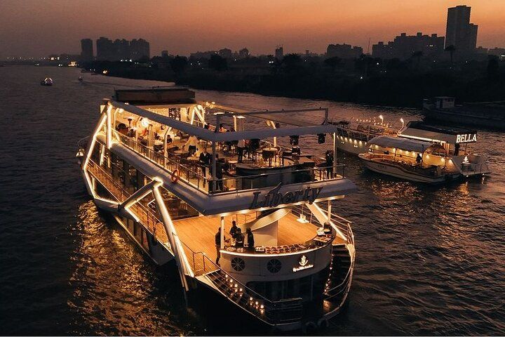 Deck view from one of the best Nile dinner cruises in Cairo showing river reflections