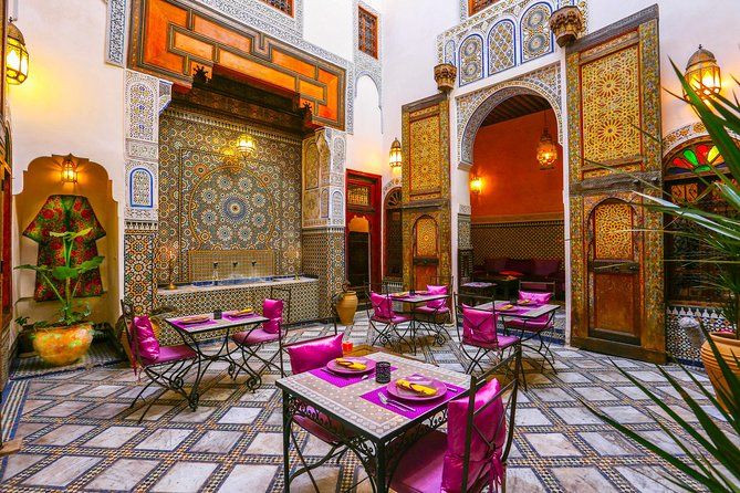Relax in a traditional Fez Riad courtyard on your Morocco guided tour