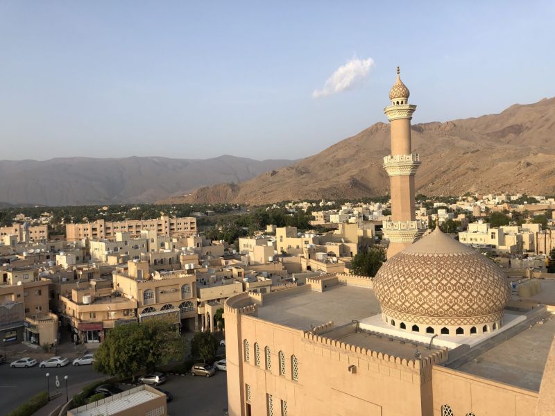 Nizwa Fort in Oman featuring its iconic circular tower and traditional desert fort architecture.