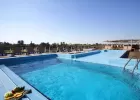 Relaxing on the sun deck of MS Movenpick Royal Lily Nile cruise – pool, sunbeds, and panoramic river views