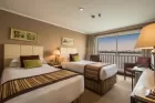 Elegant cabin interior aboard Jaz Crown Jewel Nile Cruise featuring panoramic Nile view
