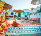 Traditional Nubian village with vibrant architecture and views of the Nile River