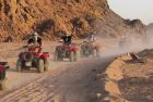 Riding through desert dunes on a safari in the Dahab quad biking tour