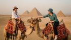 Camel ride at Giza Pyramids with Cairo desert view
