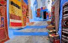 Explore the charming streets of Chefchaouen with guided Morocco tours
