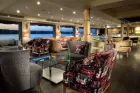 Luxurious cabin aboard MS Acamar Nile Cruise – plush bedding and panoramic window with Nile views