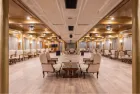 Kleos Nile Cruise indoor restaurant with dining setup