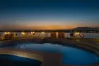Relaxing on the sun deck of Steigenberger Royale Nile Cruise – pool, sun loungers and panoramic Nile vistas under open sky