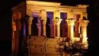 Ancient Philae Temple in Aswan Egypt glowing during the evening Sound and Light Show on Agilkia Island