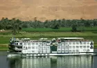 Sonesta St. George Nile Cruise by the riverbank – classic French‑style vessel sailing with refined charm