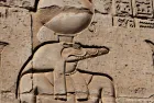 Visitors exploring the ancient Kom Ombo Temple on the banks of the Nile River in Egypt