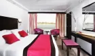 Spacious and elegant cabin aboard MS Movenpick Royal Lily Nile cruise – Nile views through large panoramic windows