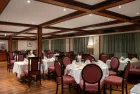 Commodore Nile Cruise indoor restaurant with dining setup